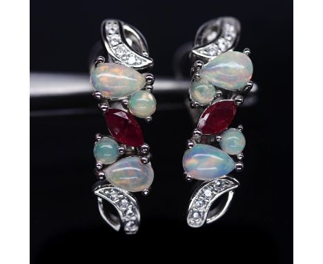 A pair of 925 silver earrings set with cabochon cut opals, marquise cut rubies and white stones, L. 1.8cm.