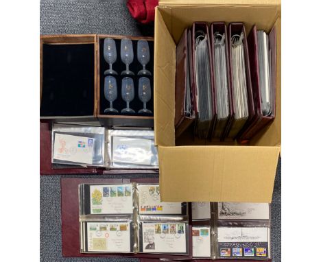 A quantity of first day cover stamp albums.