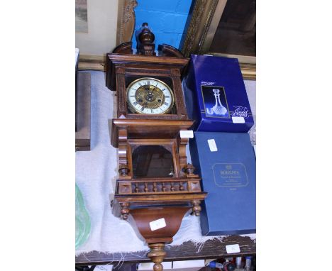 An antique Vienna wall clock in working order with pendulum and key.  Postage unavailable 