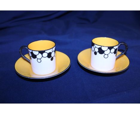 Two Art Deco period Royal Worcester coffee cans and saucers some small hairline cracks 
