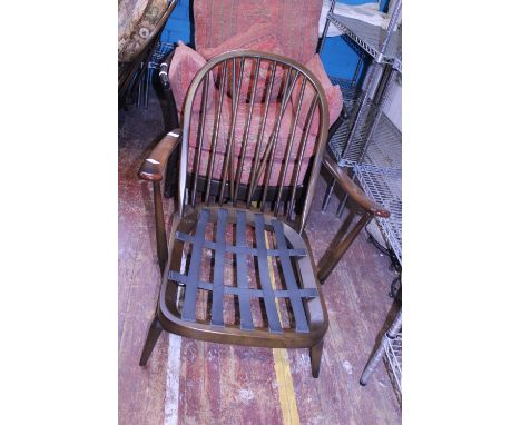 A vintage Ercol armchair. With spindle back Postage unavailable 
