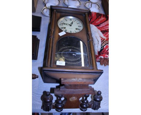 A vintage 31 day wall clock with key and pendulum.  shipping unavailable 