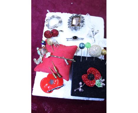 A selection of vintage brooches and stick pins etc 