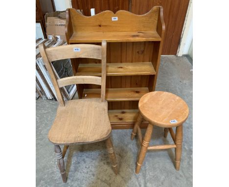 A pine open bookcase, a kitchen chair and a stool