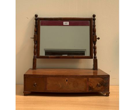 A Regency mahogany dressing table mirror, the bowfronted base with three drawers on bracket feet. 19' wide