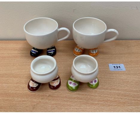 Two Carlton Ware 'walking' teacups and two eggcups