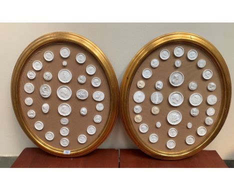 A collection of plaster portrait medallions in two oval gilt frames