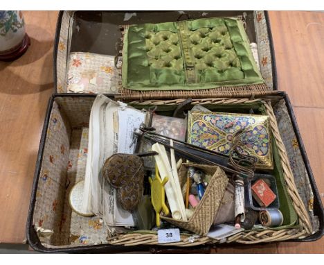 A case of vintage sewing implements