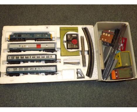 Model Railways - A Hornby OO gauge train set comprising of Diesel Electric, two passenger carriages and a Royal Mail carriage