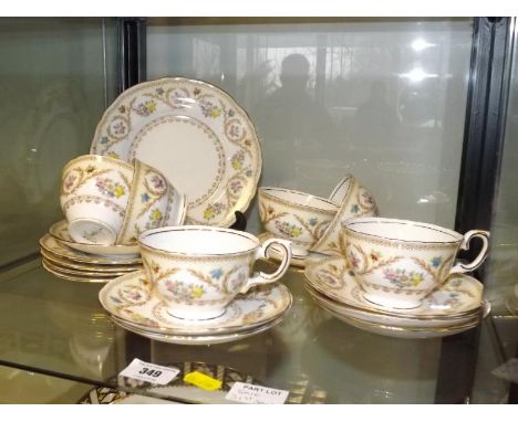 A 19 piece hand-painted Crown Staffordshire tea service, F15744 to include cups, saucers and side plates - (qty)