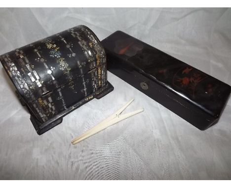 A papier mache box, a tea caddy and a pair of glove stretchers   