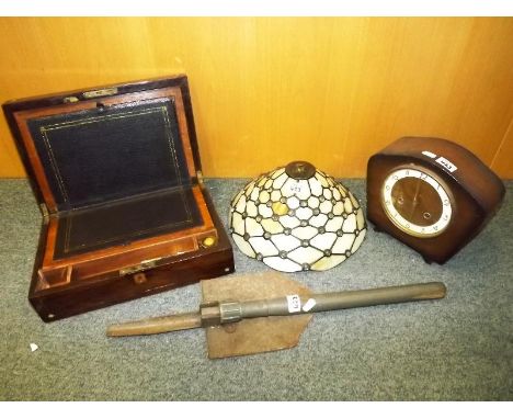 An inlaid mahogany writing slope, military folding spade, mantle clock and a Tiffany style lamp shade (4) - Est £30 - £50