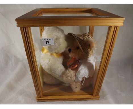 Steiff bears - a glazed display case containing two Steiff bears, Sunday's Bear and the Milllenium Bear, each with button in 