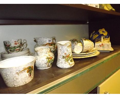 A Phoenix ware tea service decorated in a floral and foliate design with birds of paradise comprising 37 pieces cover 6 place
