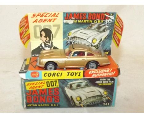 A boxed Corgi die-cast model James Bond's 007 Aston Martin DB5 No 261 with working features, cardboard display stand, opened 