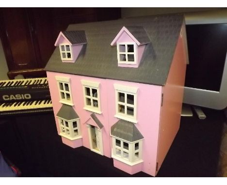 A Doll's House with hinged roof 62 cm (h), a quantity of doll's furniture, and a novelty bookcase / shelf unit, 85 cm (h) x 6