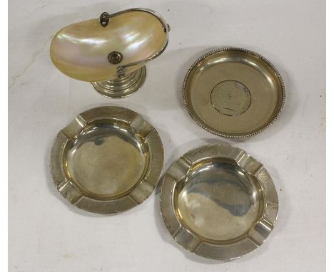 Pair of silver ashtrays with engine turned decoration, a trinket dish with coin inset and a mother of pearl mounted trinket b