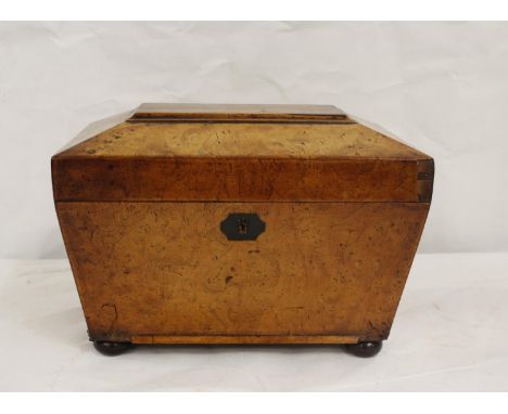 Georgian burr walnut tea caddy of sarcophagus form on four bun feet, the interior with two lidded compartments. 27cm wide 