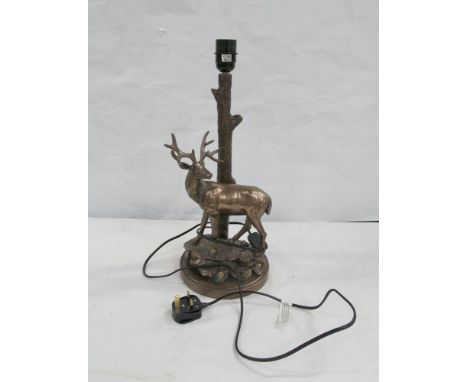 Table lamp in the form a stag, a chrystoleum and a gilt mirror. (3) 