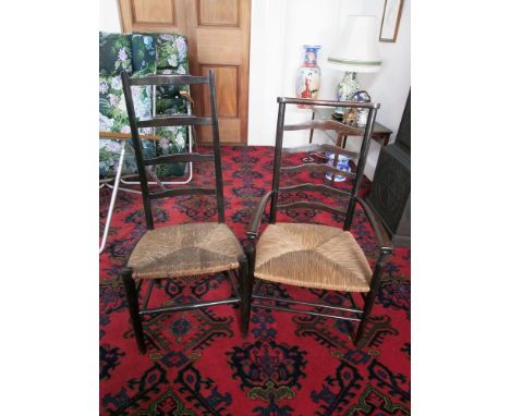 Arts &amp; Crafts style ladder back low armchair, c1900, with rush seat, and a similar side chair.&nbsp; (2). 