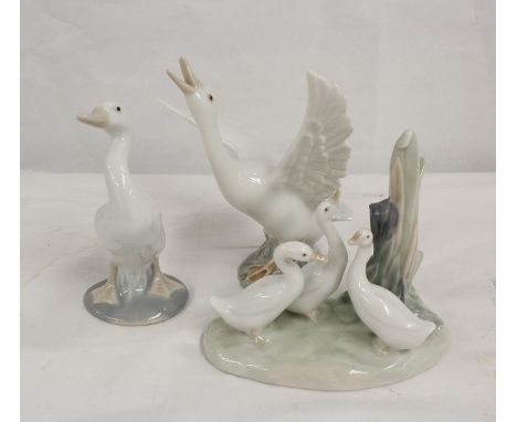 Two Lladro porcelain figures of geese and a Nao figure group of geese. Largest 14 cm. (3) 