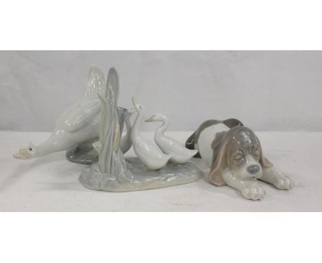 Lladro porcelain figure of a sleeping puppy and two Nao figures of geese (3) 