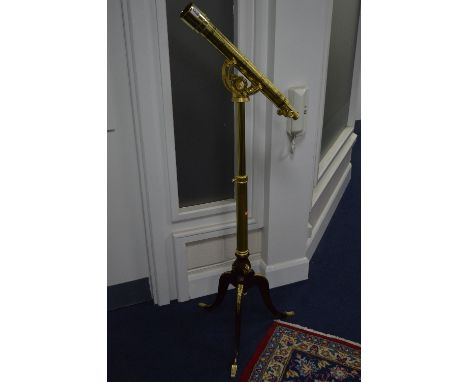  A REPRODUCTION BRASS TELESCOPE, on adjustable tripod stand of George III style, telescope bearing the old label (Observatory