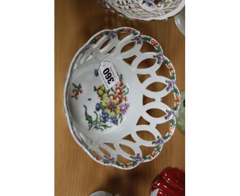 A DR WALL PERIOD WORCESTER PORCELAIN LATTICE WORK BASKET, enamelled green interspersed flower heads, wavy rim, the interior r