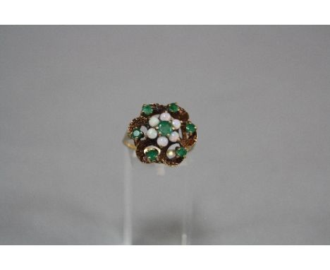 A 9CT OPAL AND EMERALD DRESS RING, ring size Q, approximate weight 4.7 grams