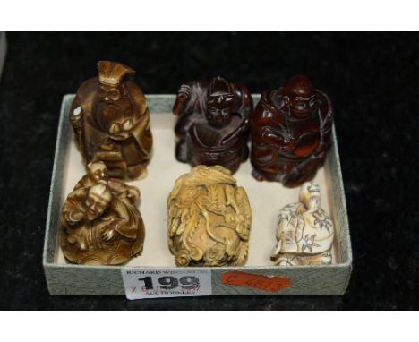 TWO STAINED CARVED WOOD NETSUKE, together with an ivory example and three others resin (6)