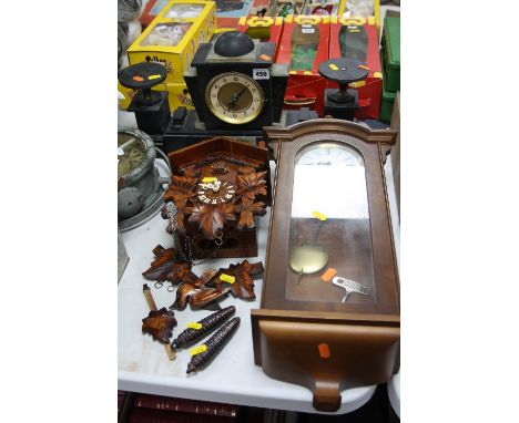 A SLATE CLOCK GARNITURE, (battery operated and glass front loose), together with cuckoo clock and an 8 day wall clock (key an