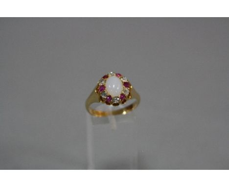 A LATE VICTORIAN OPAL, RUBY AND DIAMOND 18CT GOLD OVAL CLUSTER RING, opal measuring approximately 9 x 7mm, alternating rubies