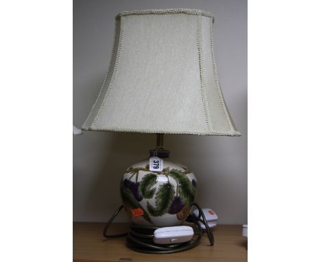 A COBRIDGE STONEWARE LAMP BASE, decorated with plums by Nicola Slaney, height approximately 15cm (not including fitting and p