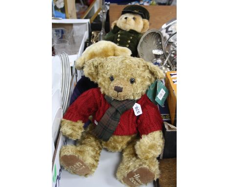 A MODERN MERRYTHOUGHT HARRODS COLLECTORS BEAR, in Harrods uniform, Merrythought label to right foot, a swing tag to neck, app