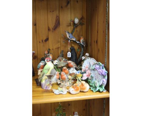 A ROYAL WORCESTER WOODPECKER, model no 3249, assorted figurines of robins and other garden birds and a robin salt and pepper 