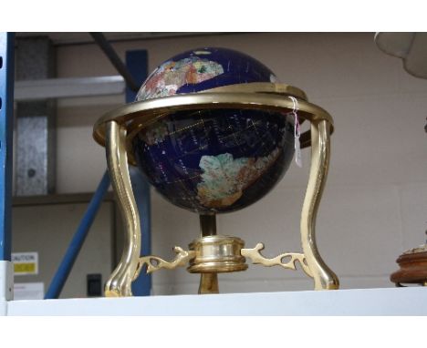 A TABLE TOP SEMI-PRECIOUS STONE INLAID TERRESTRIAL GLOBE OF THE WORLD, raised on gilt metal gimble base with compass, height 