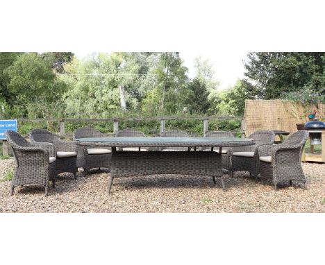 A Bridgman Marlow dining table,273cm wide135cm deep80cm hightogether with a set of eight conforming chairs,with pale seat cus