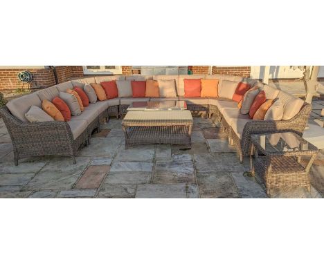 A Bridgman Marlow rattan modular garden sofa,comprising;two curved corner sections140cm wide81cm deep82cm highfive single sea