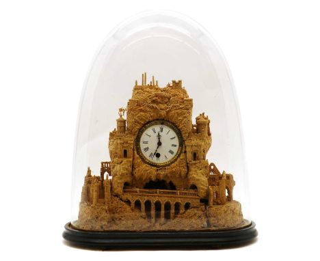 A cork clock,early 20th century, under a Victorian glass dome,the clock 30cm hightotal 45cm high