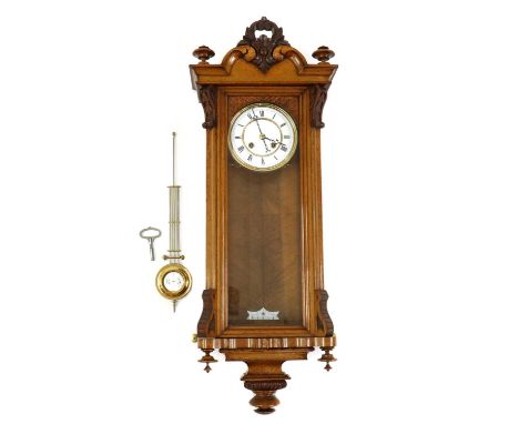 A Vienna carved wood regulator clock,early 20th century, the enamel dial with Roman chapter ring and pierced steel hands, wit