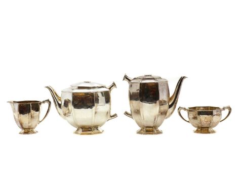 A four piece silver tea service,by Robert Edgar Stone, London 1939, comprising a coffee pot, 19cm high, and teapot, 18cm high