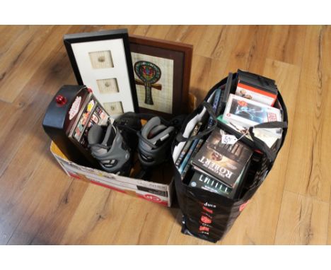 Bag of DVD's and box of pictures, roller blades and slot game