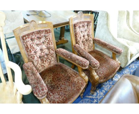Two heavily carved antique style button backed chairs