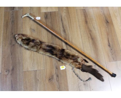 Fur stole and an antler topped walking stick