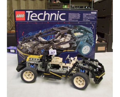 Lego Technic: car model 8880. part built but all pieces present with box and instructions 
