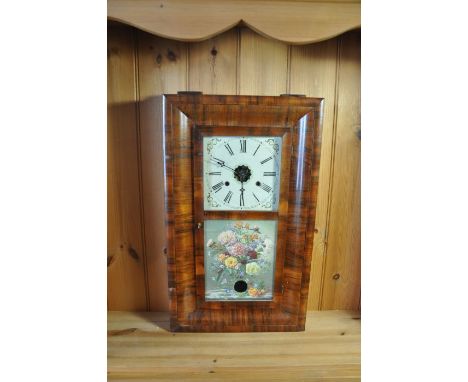 An American cased wall clock, the glass panel door decorated with flowers