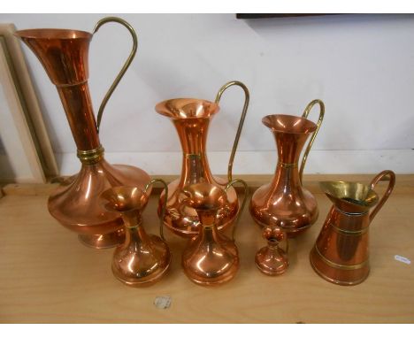 7 Copper jugs and 1 ceramic jug