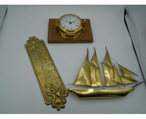 A Brass ships clock 'Barigo' 10cm approx. width of clock face. with a model of a sailing ship 25cm at widest point and a bras