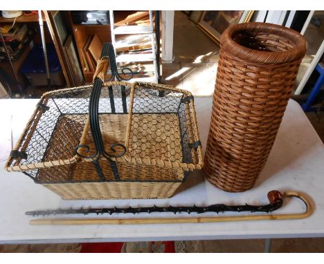 Wicker walking stick holder, wicker picnic basket and 2 walking sticks
