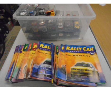 Rally car model collection with magazines